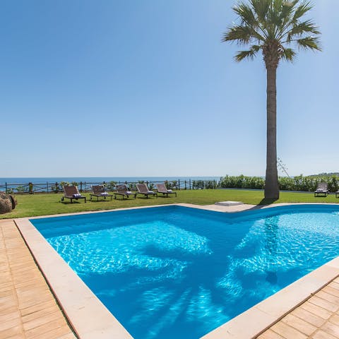 Spend lazy days by the pool or follow the path down to the beach