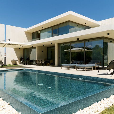Float in the calm waters of the private infinity pool