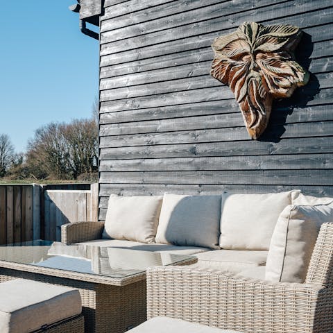 Soak up the sunshine under the vigilant eye of the Green Man
