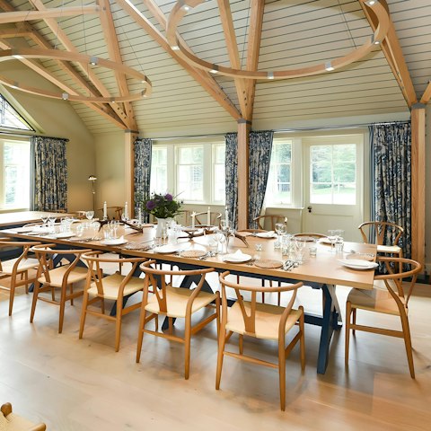 Savour hearty meals gathered at the grand dining table