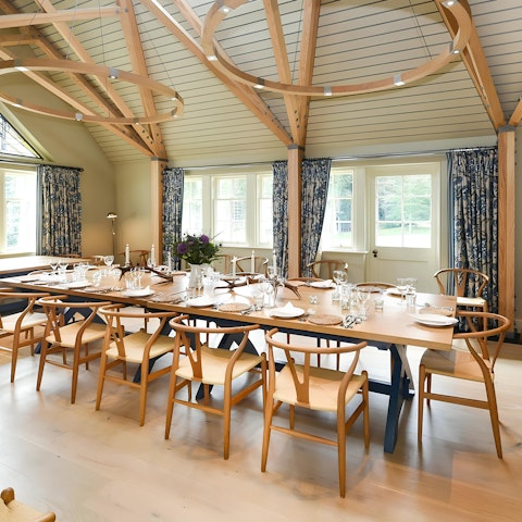 Savour hearty meals gathered at the grand dining table