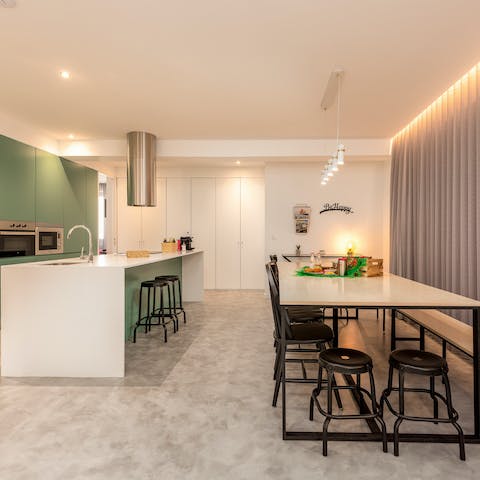 Make full use of the slick kitchen-dining set-up with some big group meals
