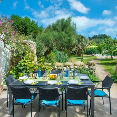 Gather around the alfresco dining set for feasts at sunset