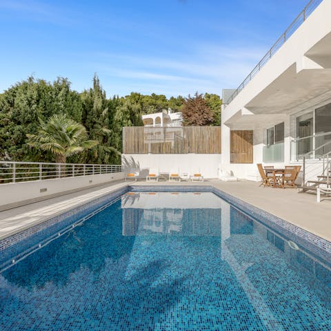 Make a splash in the swimming pool on a sunny day