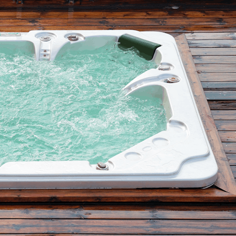 Luxuriate in the hot tub and feel your stresses slip away