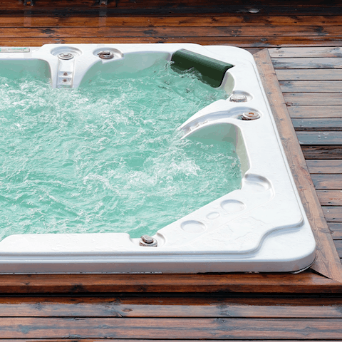 Luxuriate in the hot tub and feel your stresses slip away