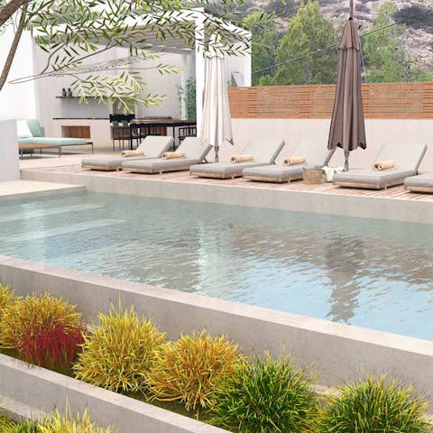 Dip into the beautiful stone pool set into the forested hills