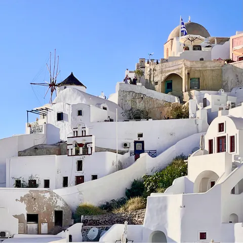 Explore the whitewashed houses and winding streets of Mykonos