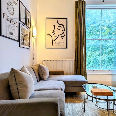 Relax with a good book and a glass of wine in the bright living room