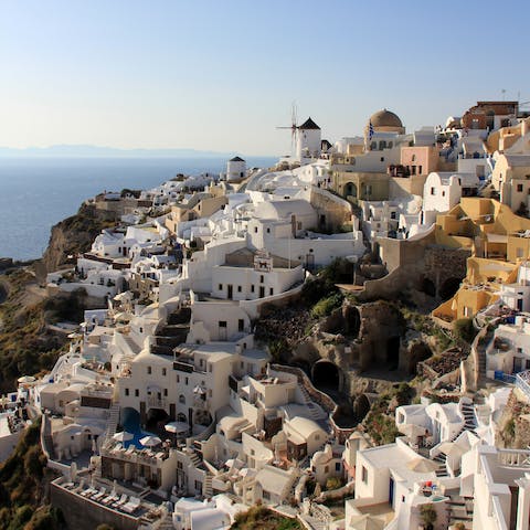 Explore Oia and visit the Castle of Agios Nikolaos, a two-minute walk away