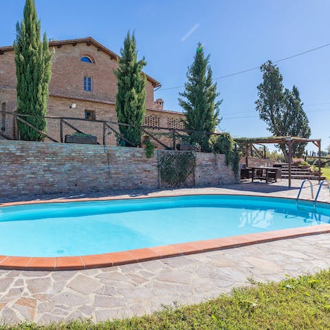 Plunge into the inviting swimming pool and float the day away