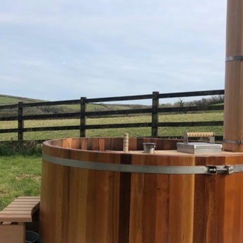 Admire rural Cornwall from the comfort of the wood-fired hot tub