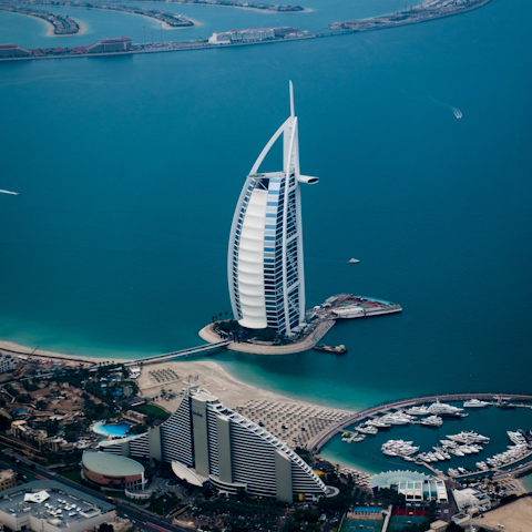 Explore the Palm Jumeirah's exclusive sandy beaches nearby