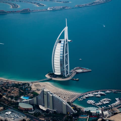 Explore the Palm Jumeirah's exclusive sandy beaches nearby