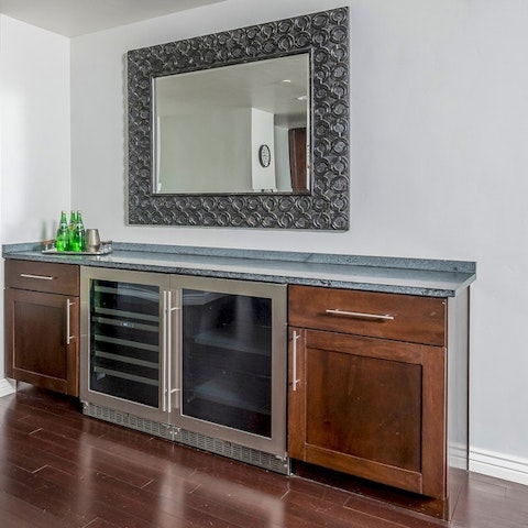 Prepare a drink at the wine bar