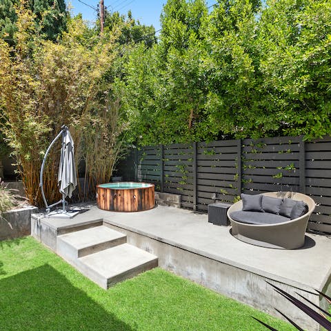 Step into the garden and enjoy a long soak in the jacuzzi