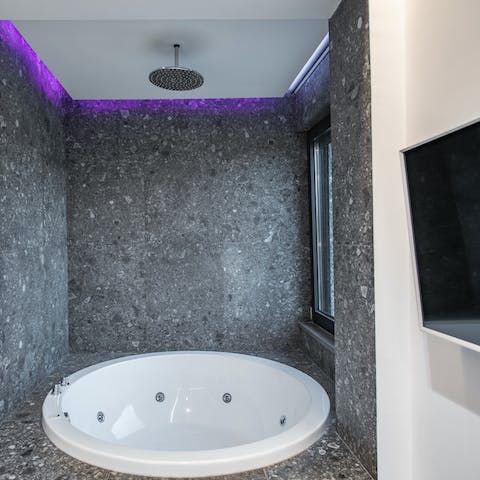 Soak away the stress in the hot tub, from where you can catch up on your favourite series