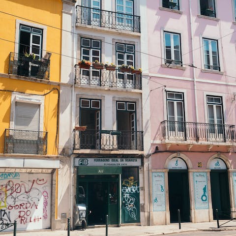 Visit the bustling Bairro Alto, a sixteen-minute tram ride away