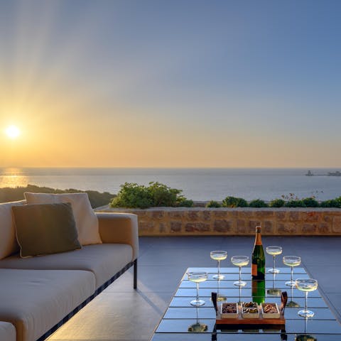 Catch the sunset as you enjoy a cocktail outside