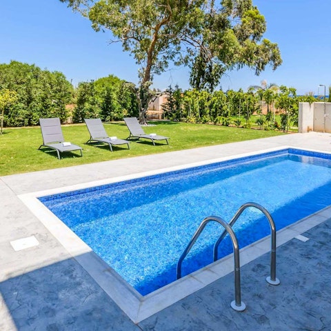 Relax on a lounger before cooling off in the private pool