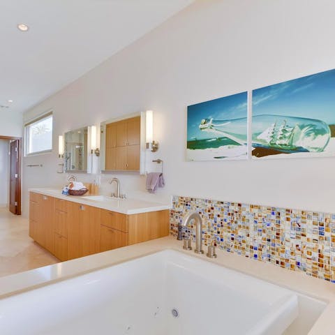 Sink into the depths of the jetted tub & enjoy some well–deserved relaxation
