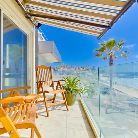 Head out onto the private balcony to admire the breathtaking ocean views