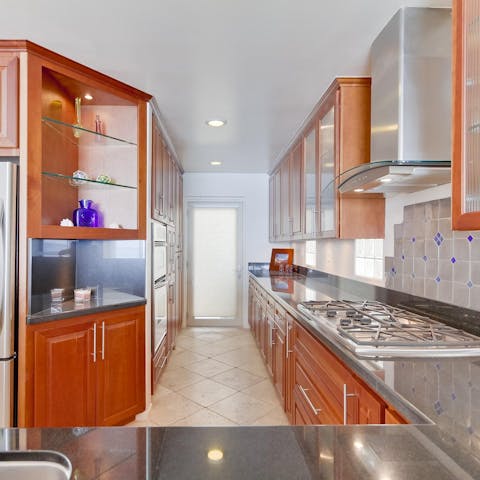 Rustle up a scrumptious feast in the fully–equipped kitchen