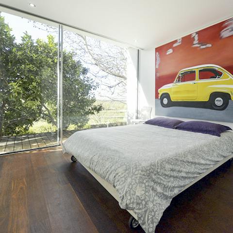 Wake up and enjoy immediate outdoor access through the floor-to-ceiling doors