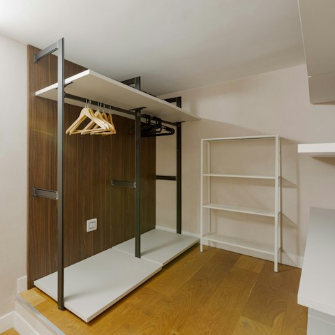 Hang up your fashion finds in the walk-in wardrobe