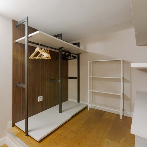 Hang up your fashion finds in the walk-in wardrobe