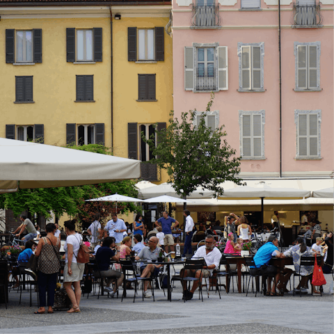 Watch the world go by from a street cafe in Como – a twenty-minute drive away