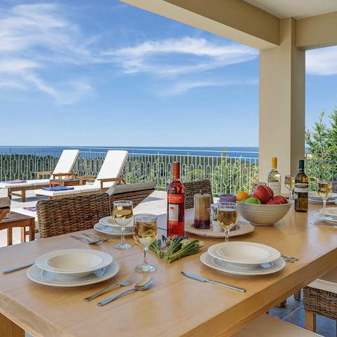 Share delicious feasts and Greek wine out on the terrace, with the glorious panorama