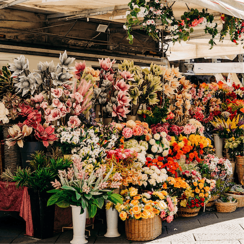 Experience the colourful vibrancy of Columbia Road Flower Market, a four-minute stroll away