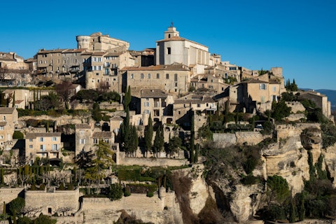 Marvel at Gordes, one of France's most beautiful hilltop villages perched above the Luberon, about thirty minutes by car