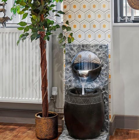 Feel serene and at peace amongst the nature-themed interiors, including a stunning water feature