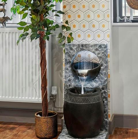 Feel serene and at peace amongst the nature-themed interiors, including a stunning water feature