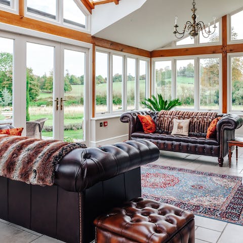 Relax with drinks and sweeping green views