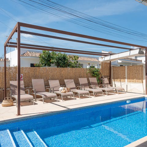 Sprawl out on the poolside lounge chairs with a holiday read