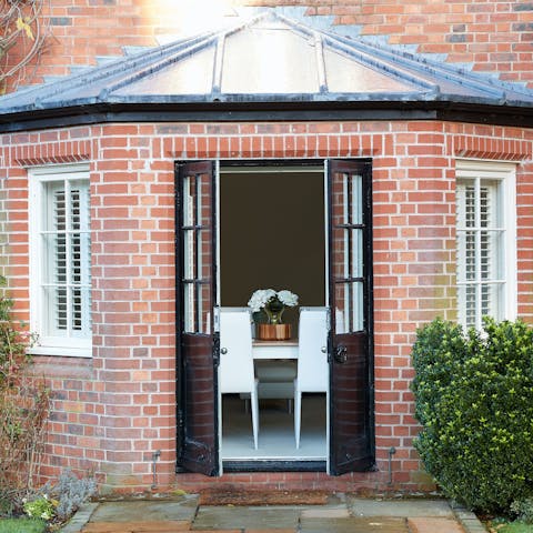 Soak up the garden views through the bay window’s French doors