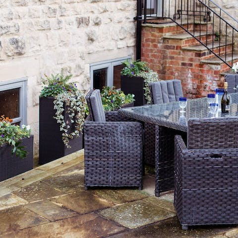 Share a bottle of wine on the outdoor terrace