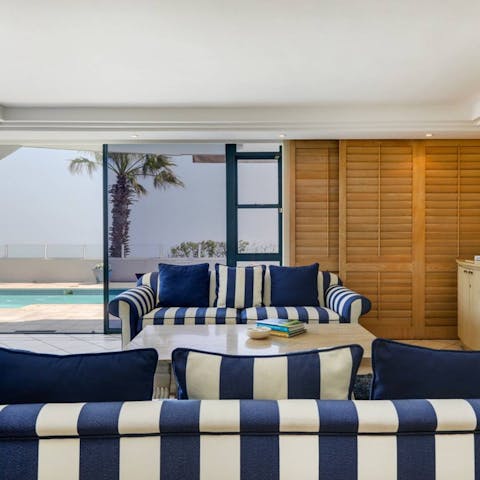 Kick back and relax in the bright living room with a glass of South African wine