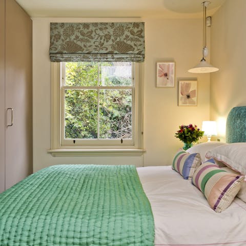 Wake up and open your blinds to start your day with a view of the flickering trees