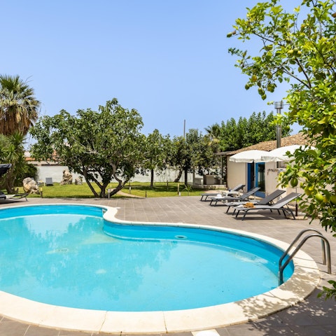 Savour the sunshine from the swimming pool