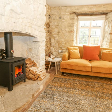 Settle down with a glass of wine by the wood burner after a busy day