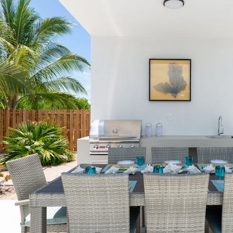 Grill up a barbecue at the outdoor kitchen and dining area