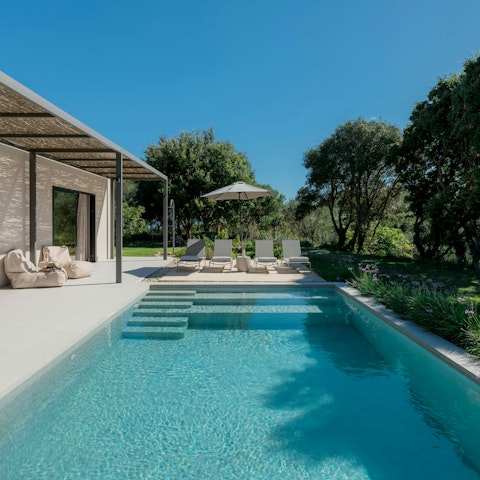 Relax in the Greek sun next to the private pool