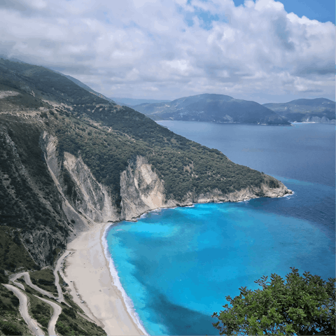 Spend the day on the powdery sands of Meloi beach, a five-minute walk away