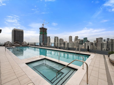 Swim laps above the Miami skyline on the rooftop deck