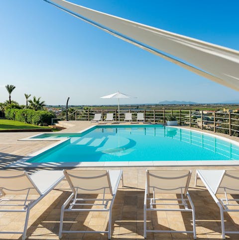 Take in the vistas of Western Sicily from the infinity pool