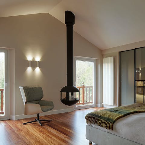 Snuggle up in bed with this uniquely designed fireplace